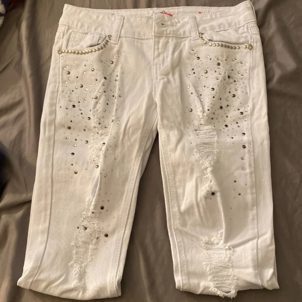 Ripped white jeans with sparkle